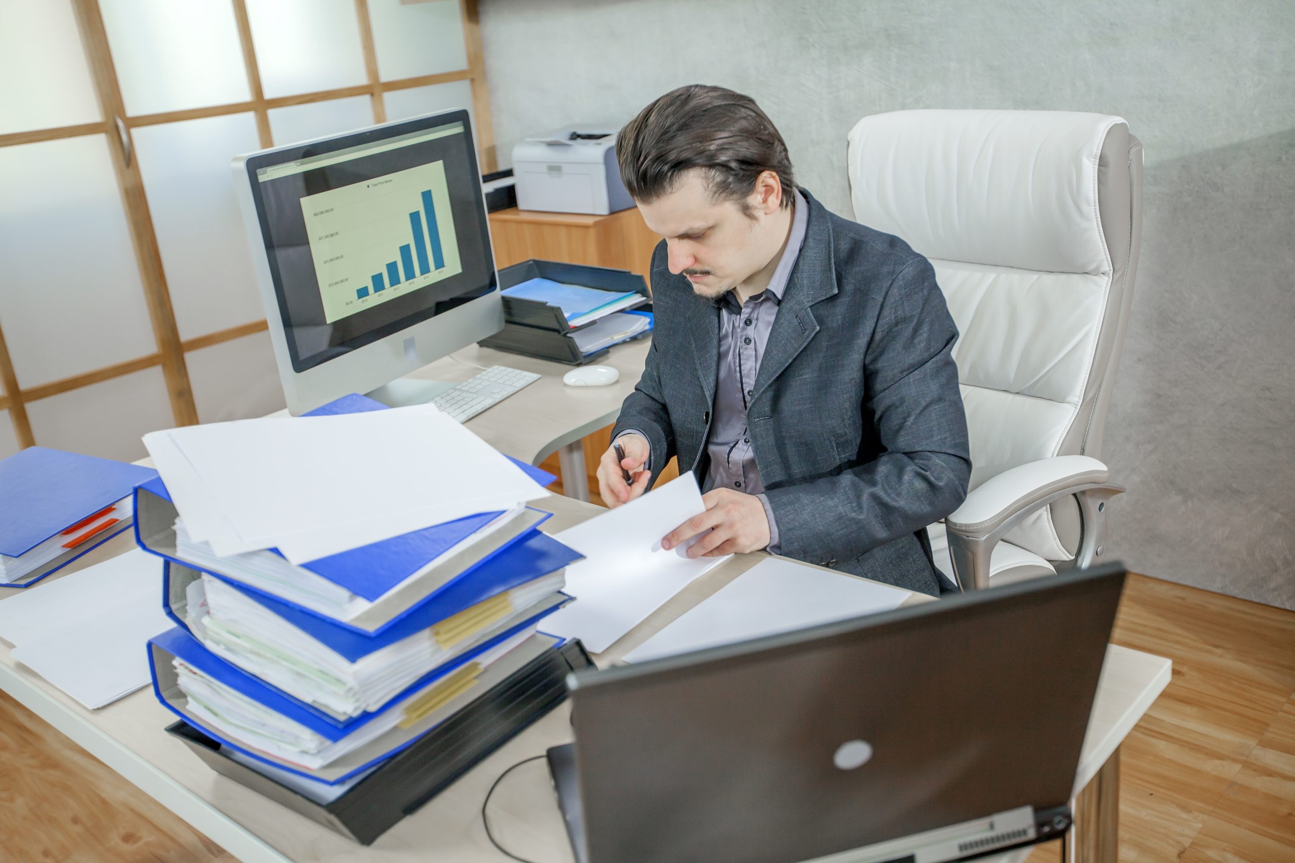 A young businessman working from his office - the concept of hard work